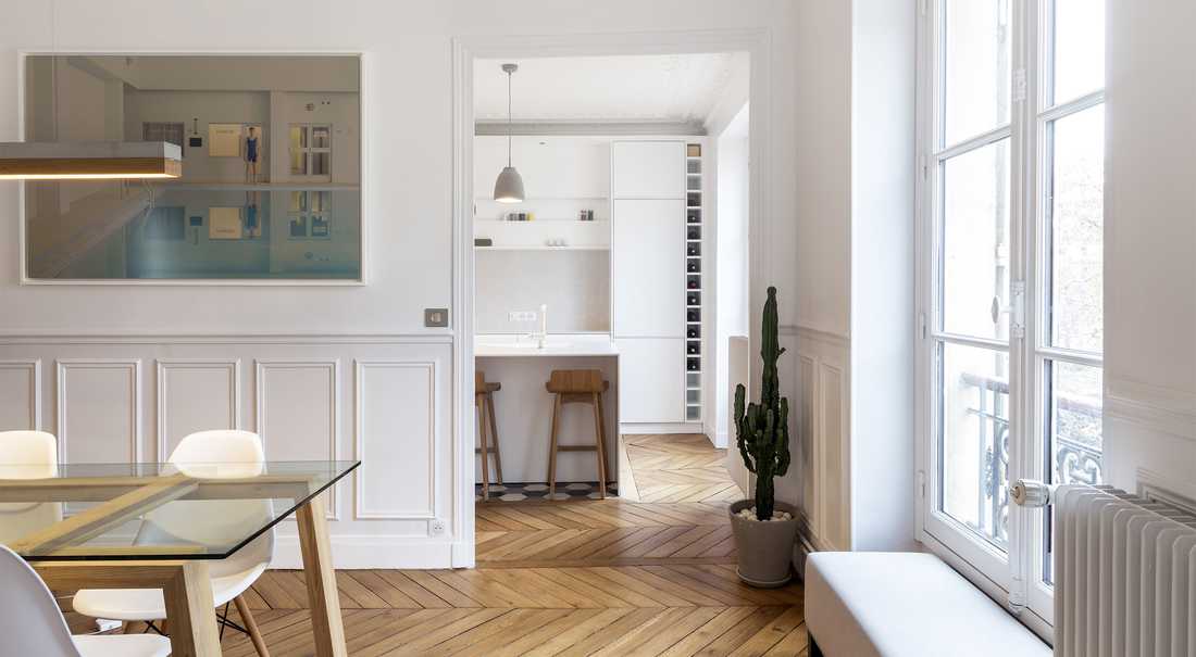Aménagement d'un cuisine ouverte dans un salon par un architecte à Paris